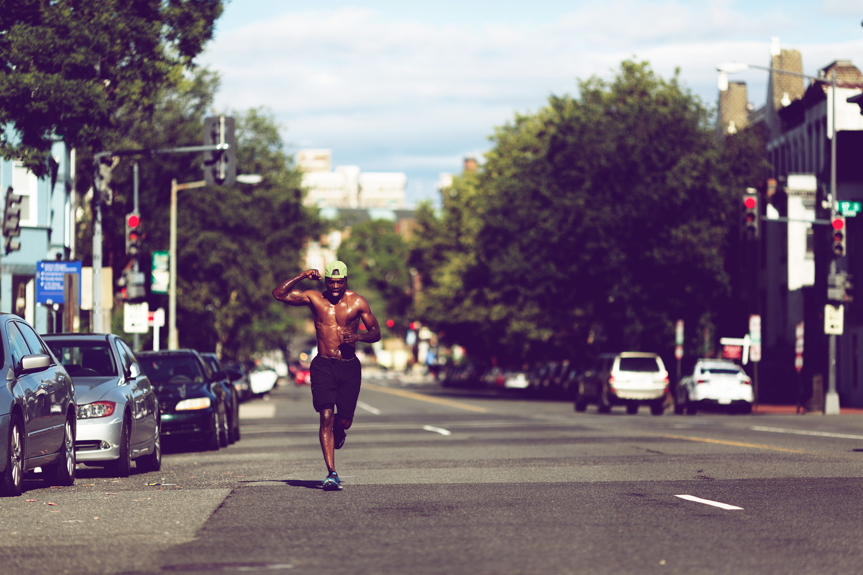 pumped runner dashing down city street for washington dc commercial photography