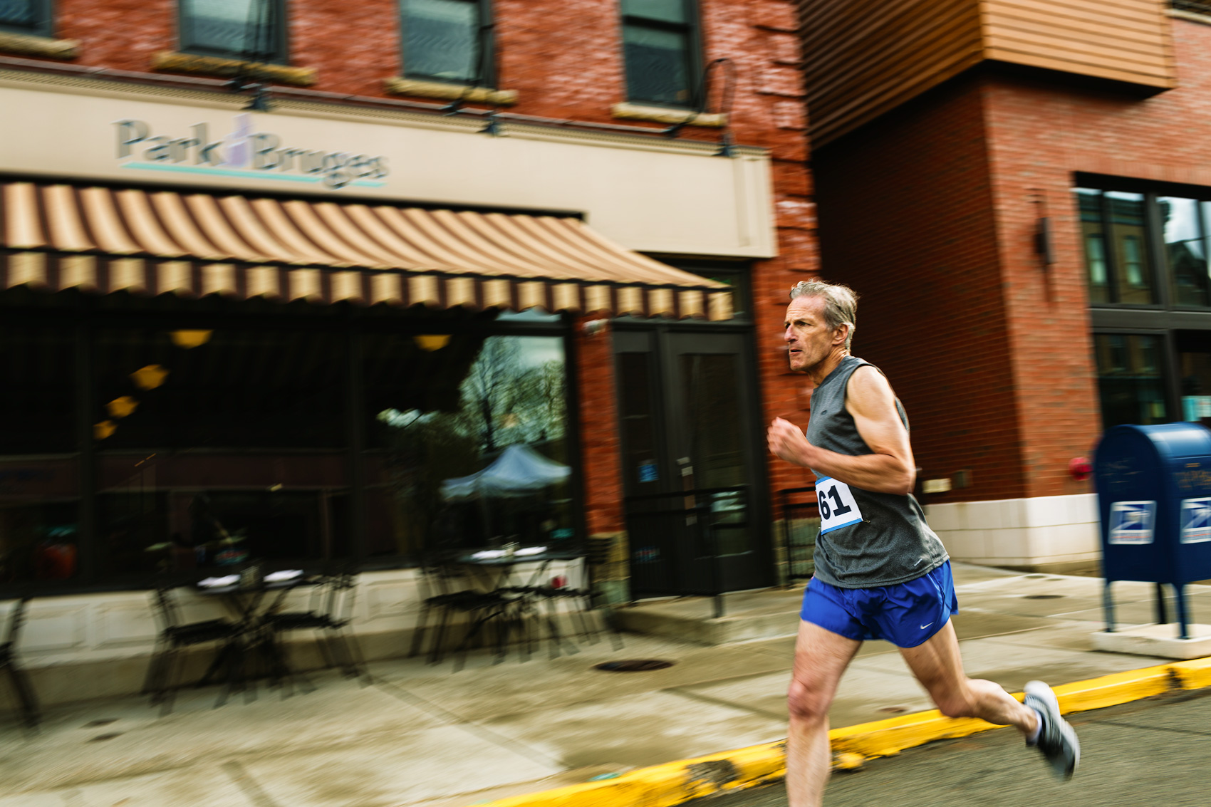 marathon runner racing down street for washington dc commercial photography