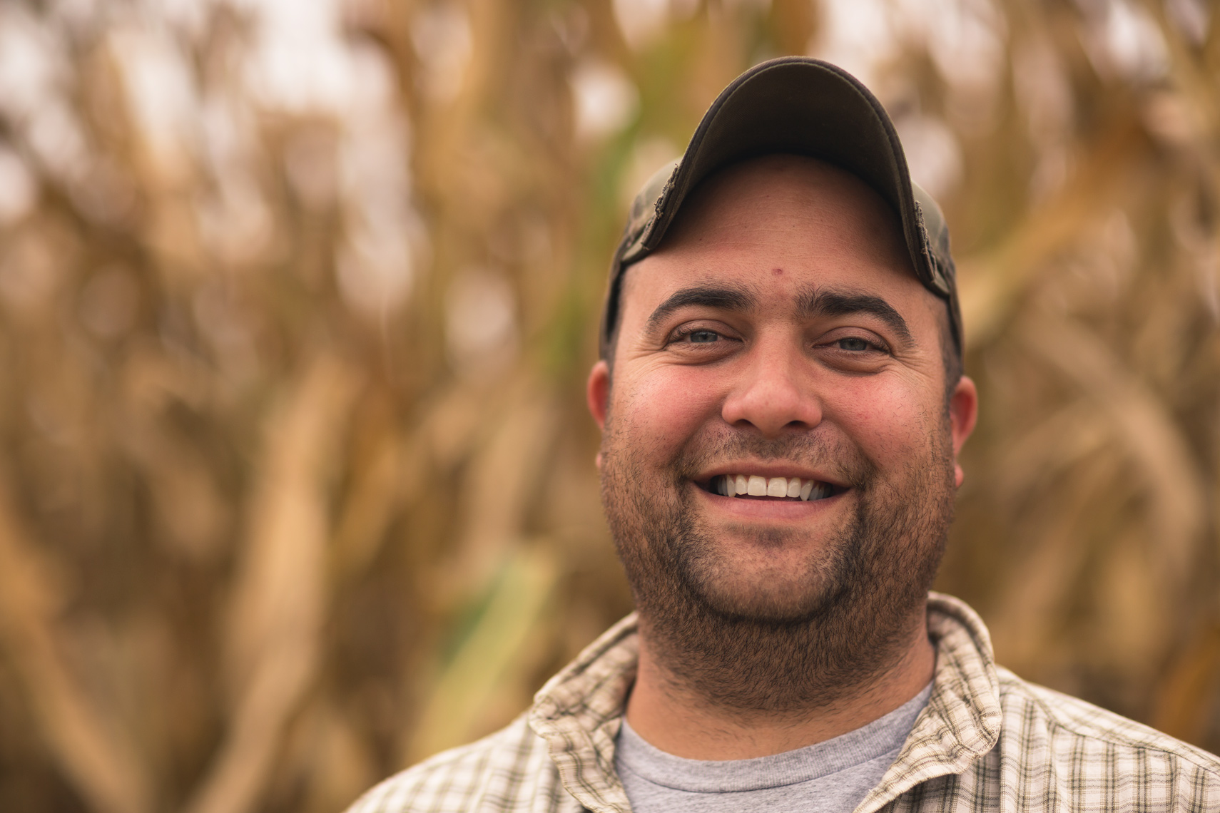 grain farmer in front of corn for washington dc industrial photography