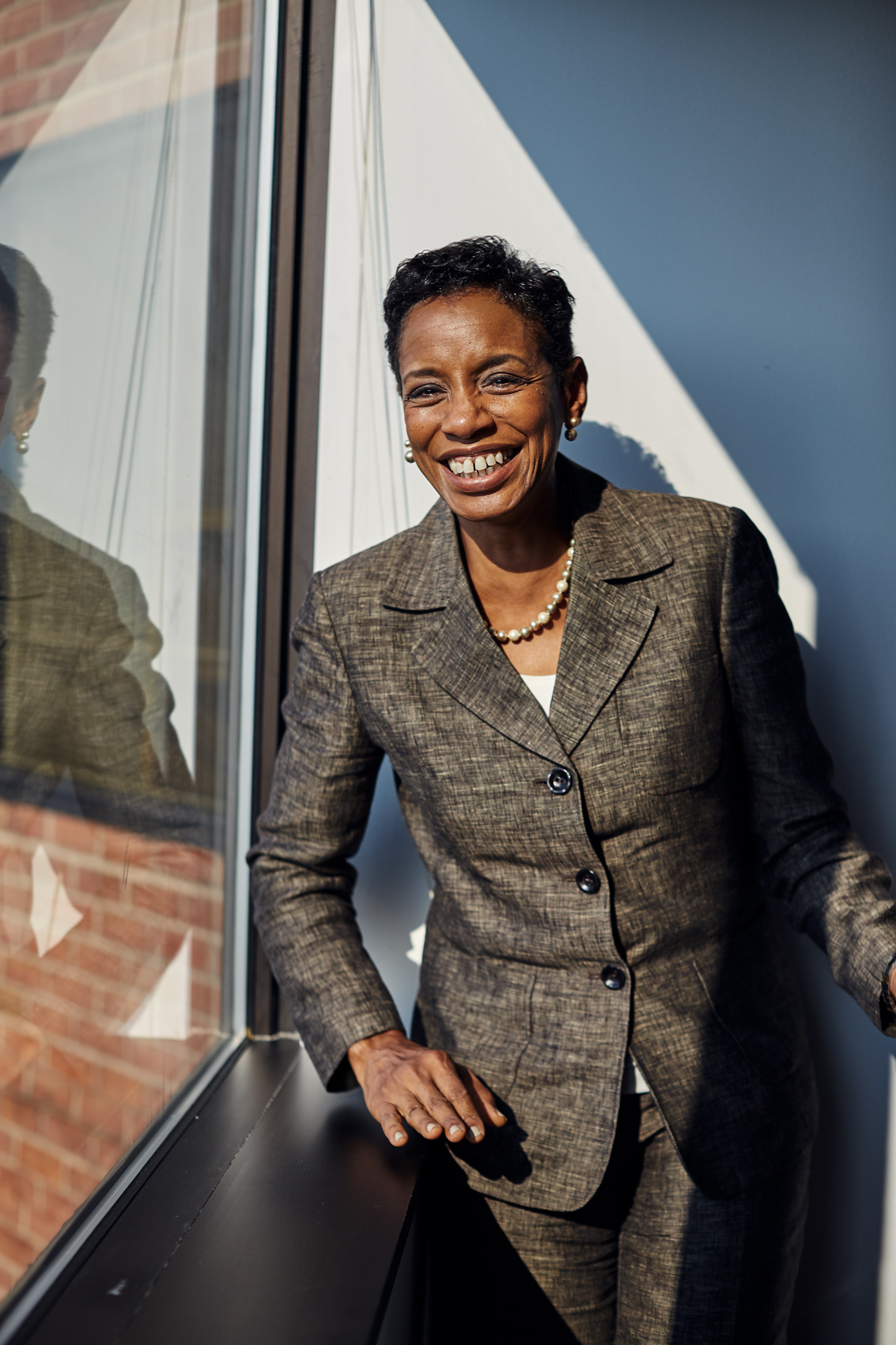 Former Maryland Congresswoman Donna Edwards poses for a portrait by a window in her campaign office.