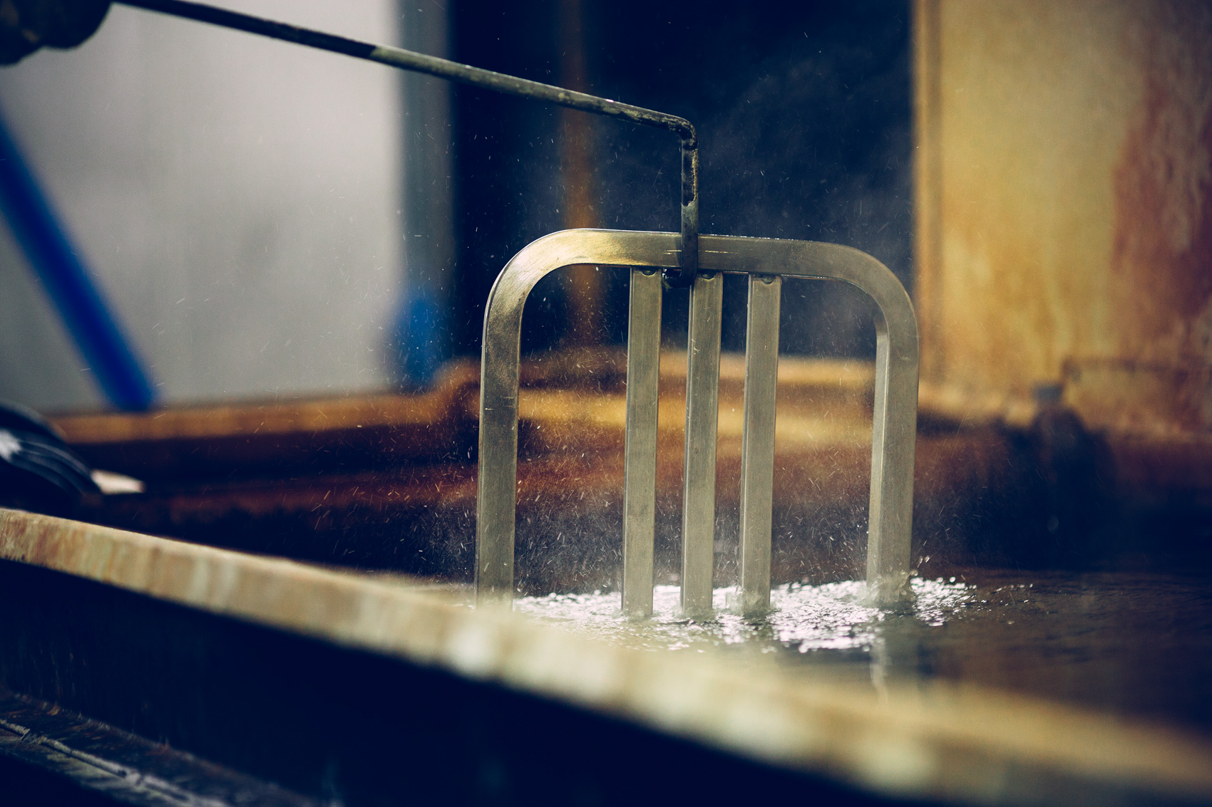 chair dipped in bath at factory for washington dc industrial photography