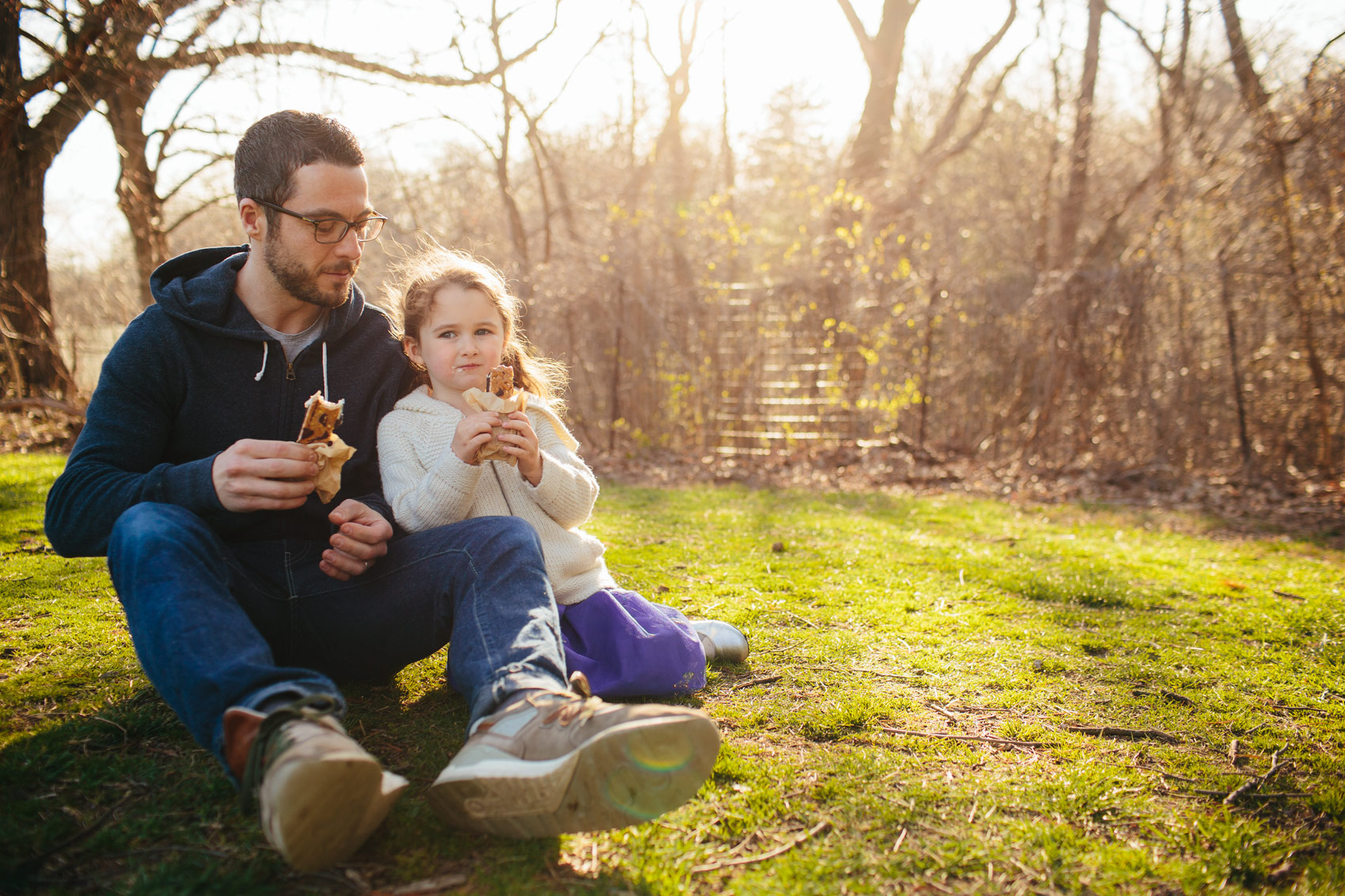 father and daughter eating ice cream sandwiches in park, washington dc commercial photography