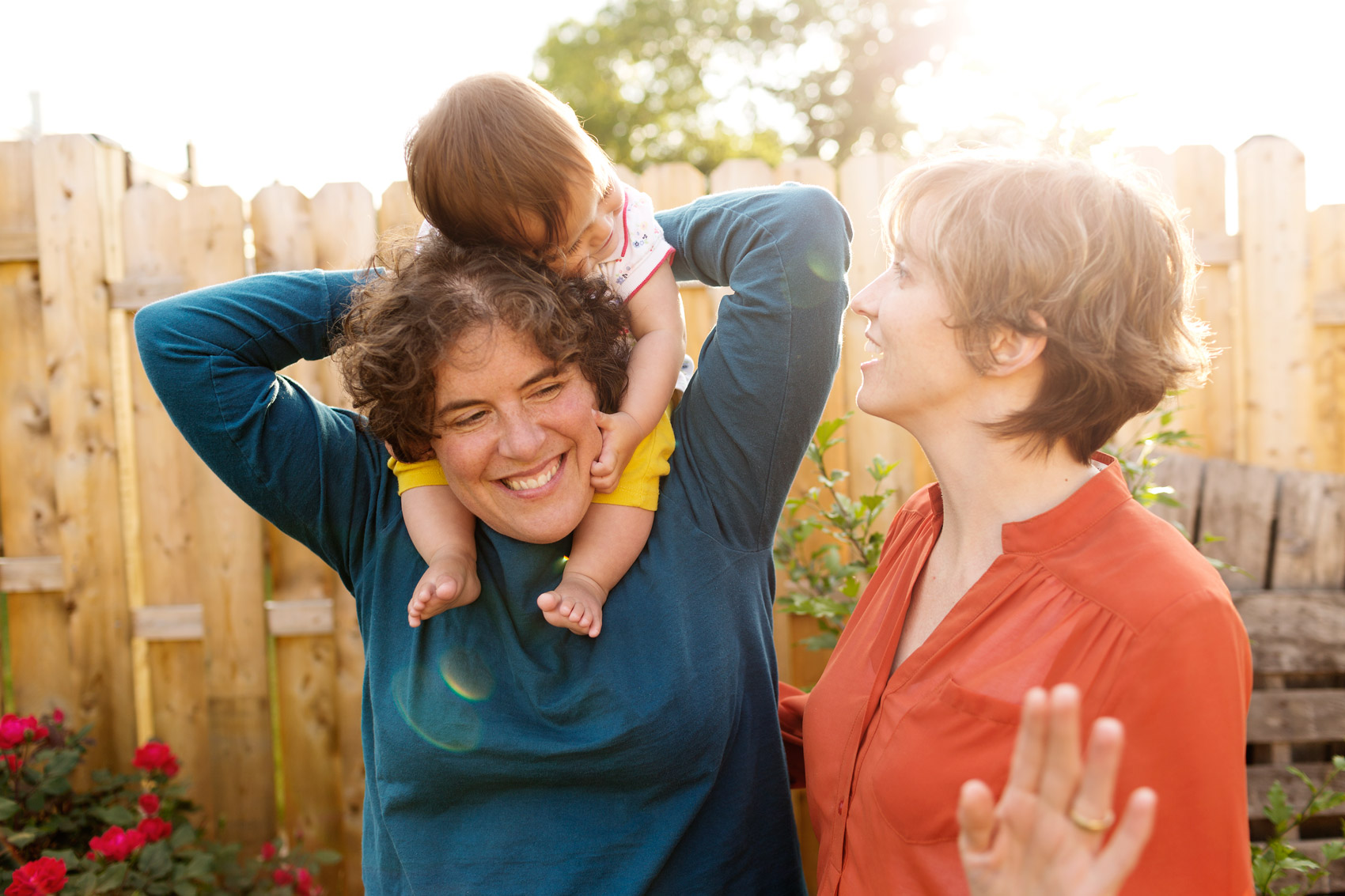 two moms laugh with daughter for washington dc commercial photography