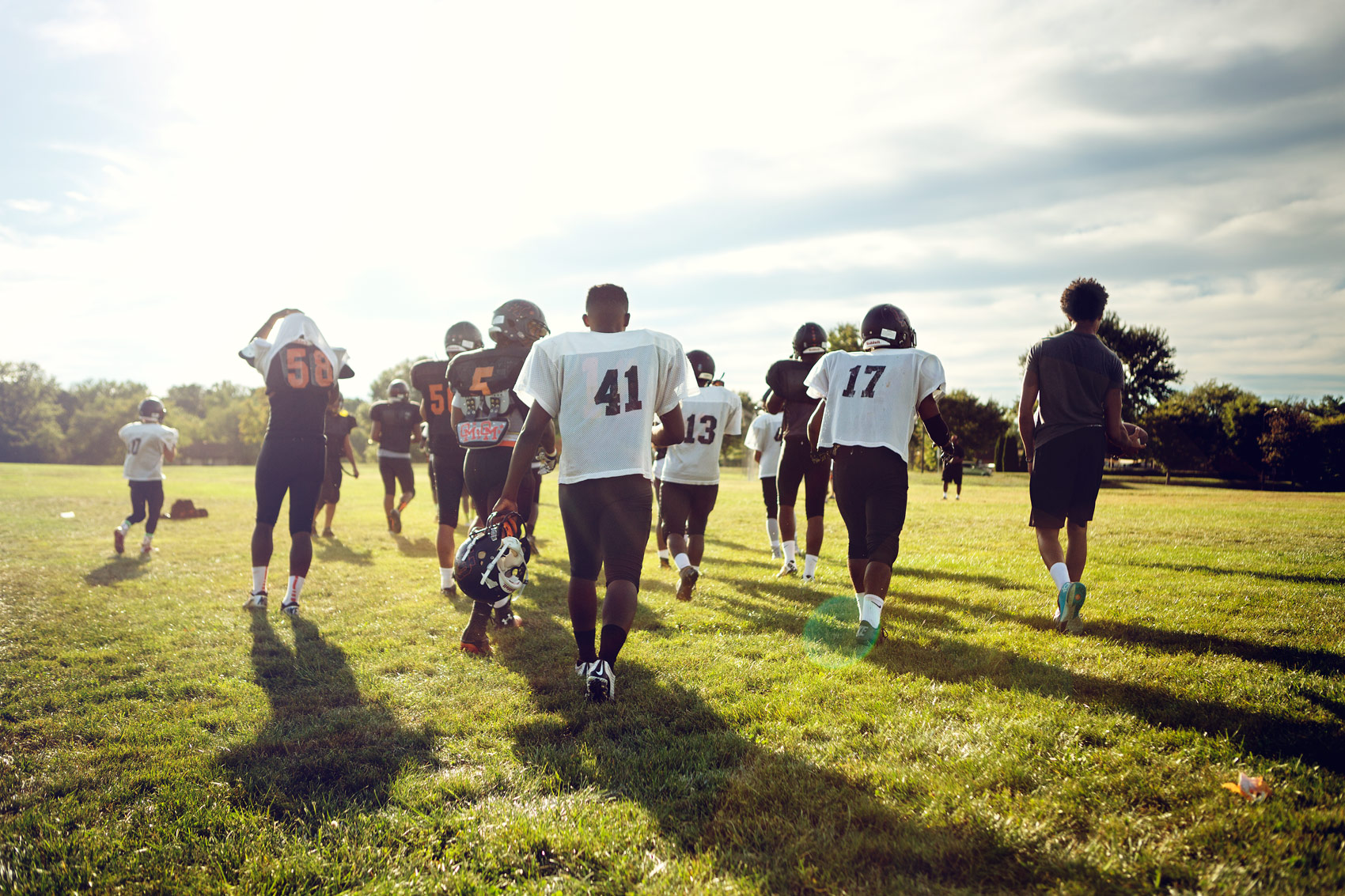 High school football team Oakland Mills Scorpions depart the field after a practice.