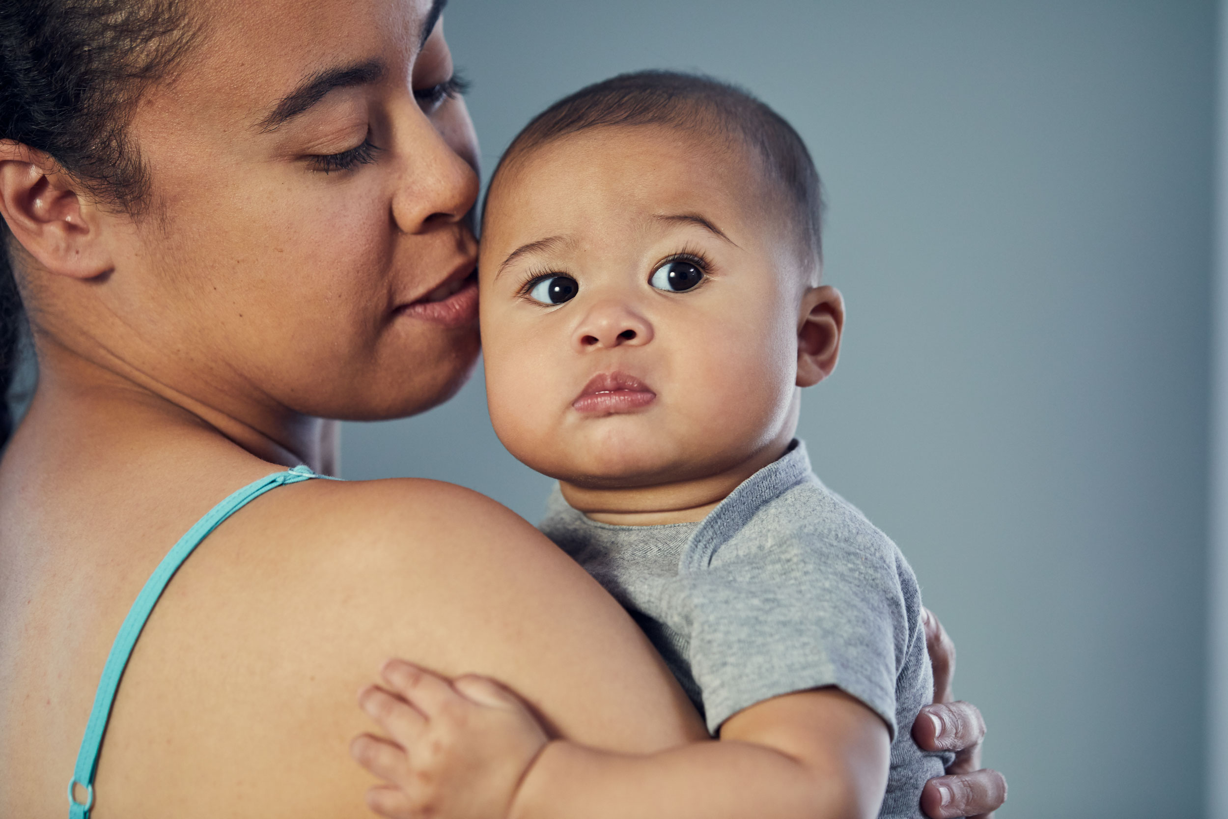 mom kissing and holding baby on head, washington dc commercial photography