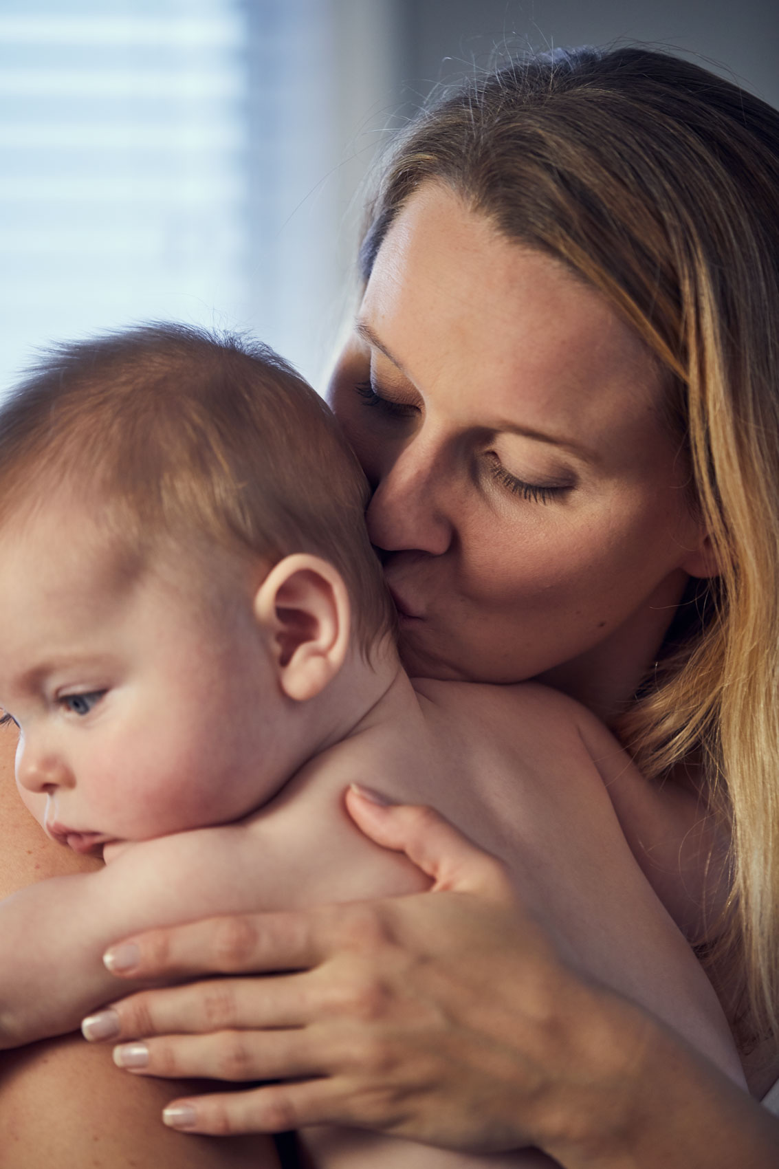 mom kissing baby on neck, washington dc commercial photography
