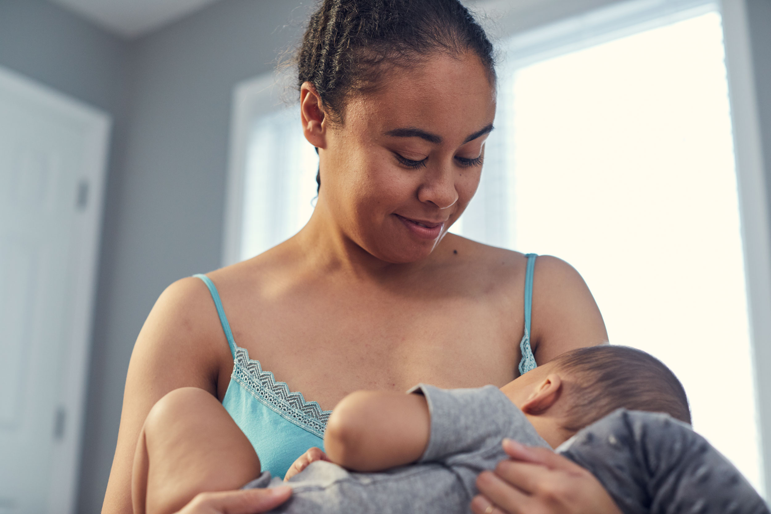 mom breastfeeding baby with nursing pillow, washington dc commercial photography
