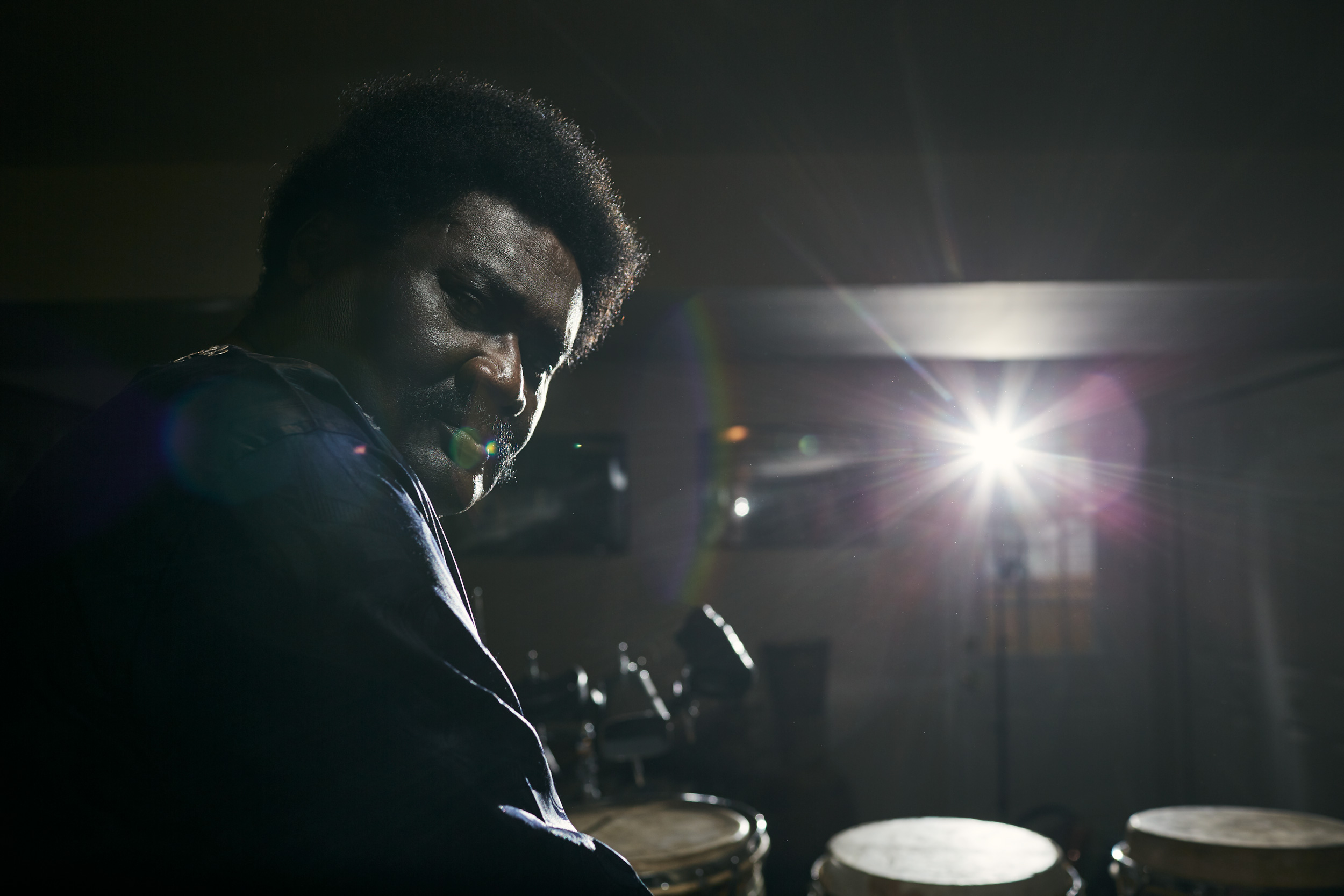 Okyerema Asante portrait with drums, washington dc portrait photography