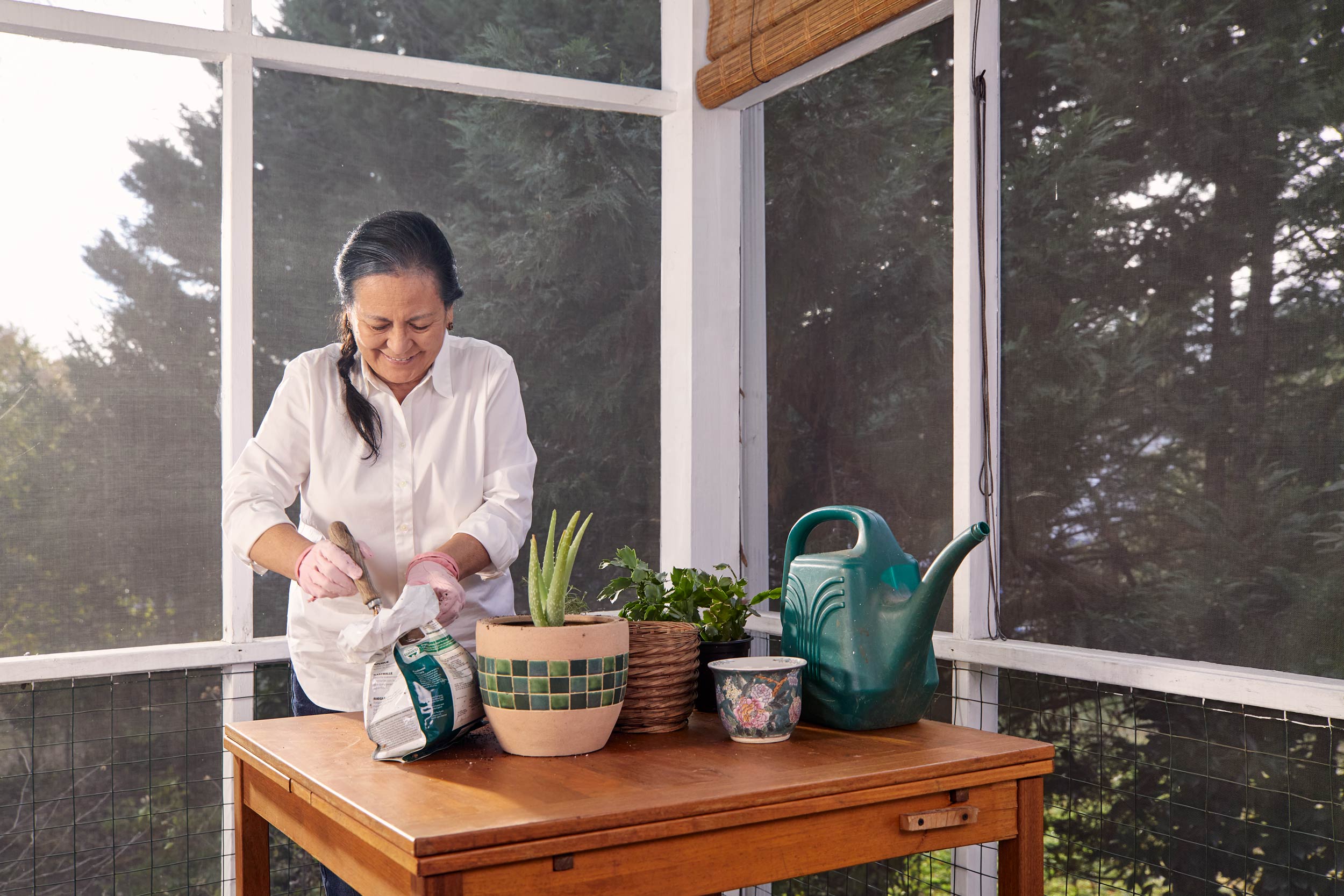 older-woman-repotting-plants-dmv-commercial-photography-eli-meir-kaplan
