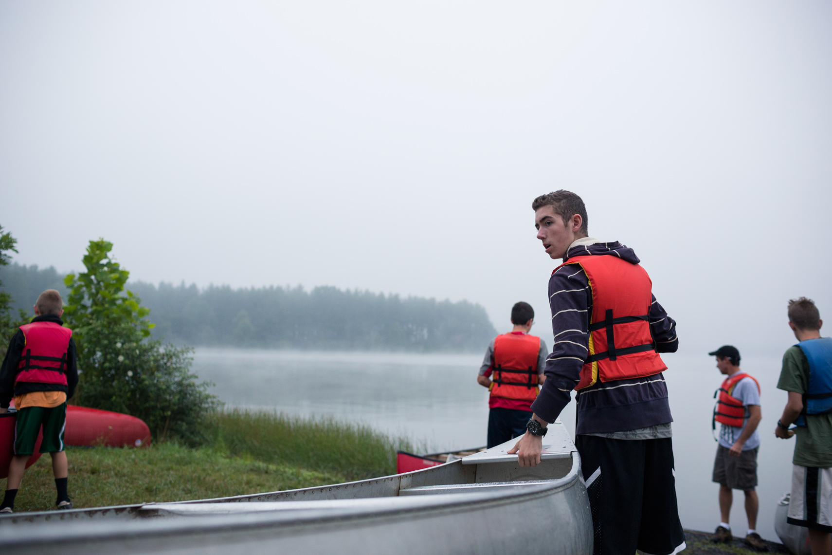 boy scouts carried canoe near foggy lake washington dc photjournalism