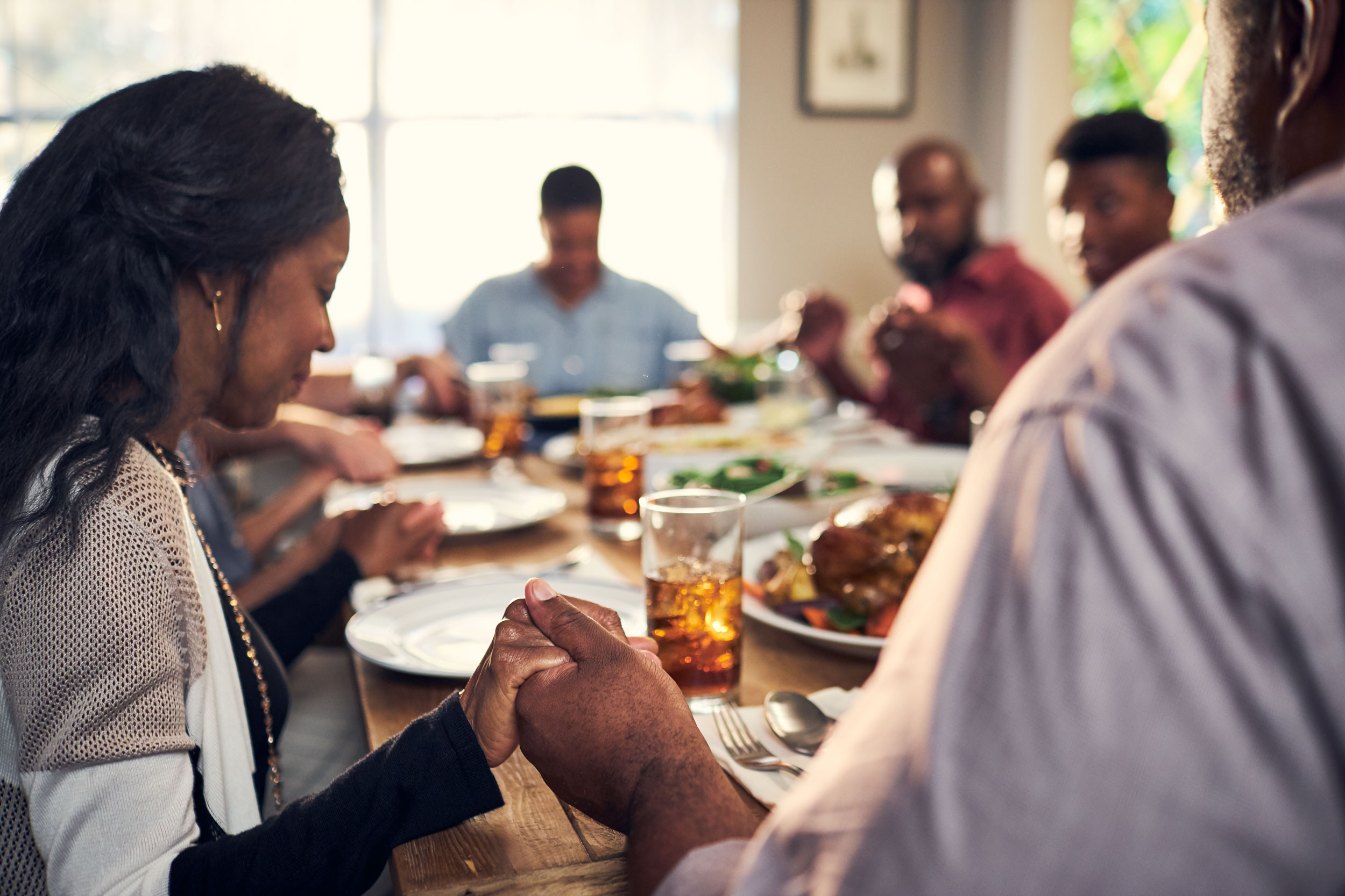 family saying grace over meal, washington dc commercial photography