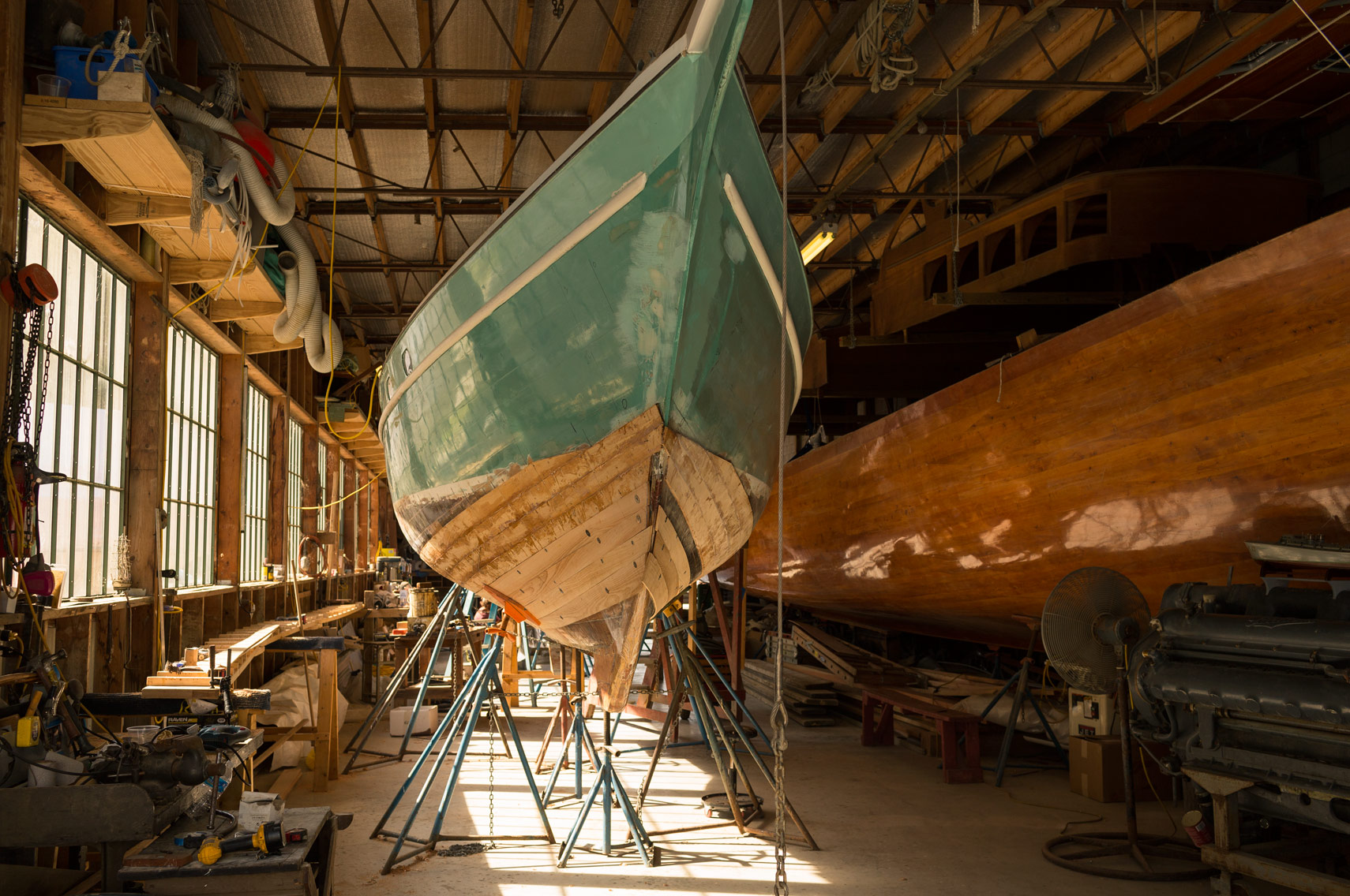 wooden boat being repaired at shipyard at washington dc industrial photography