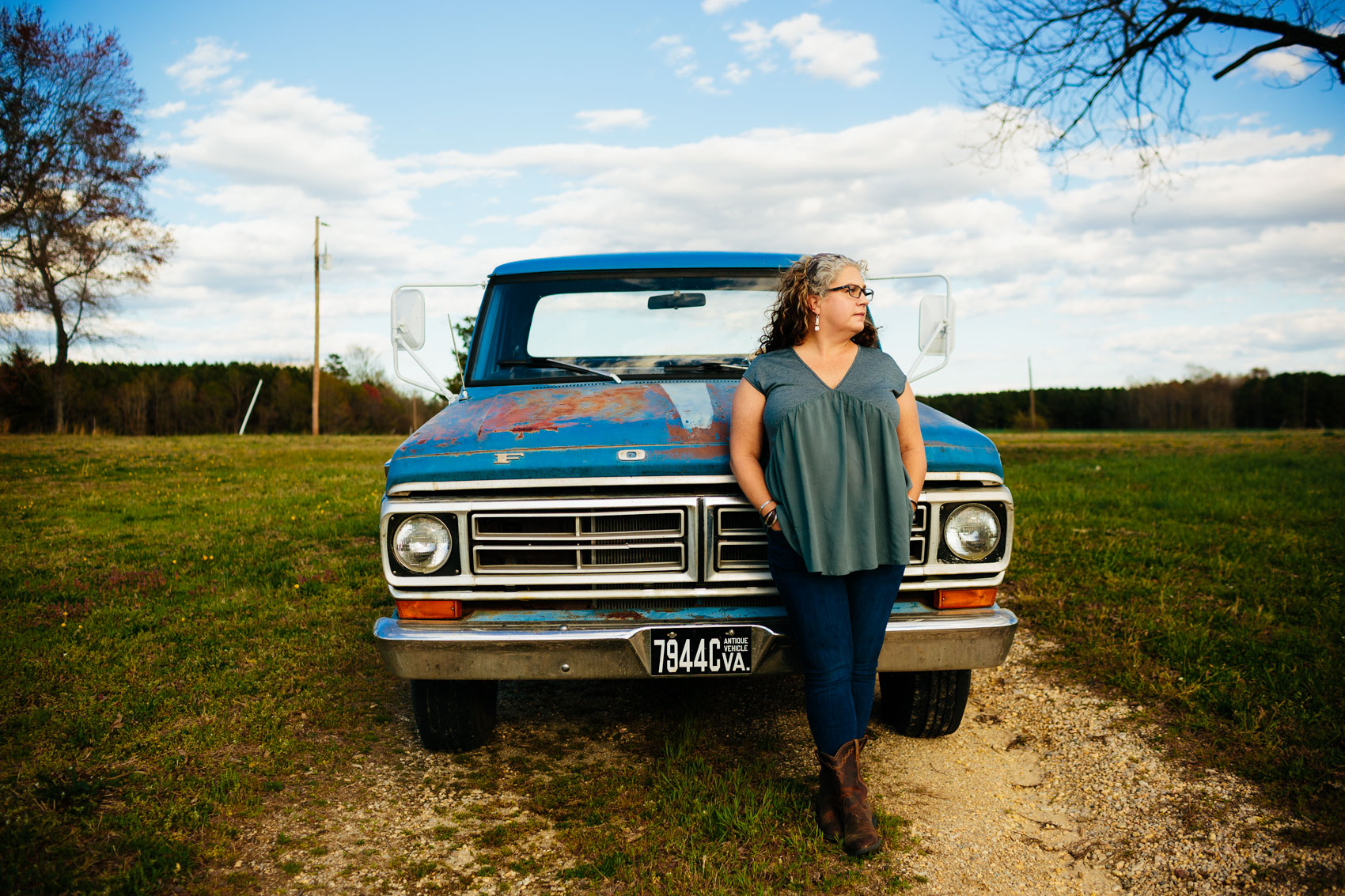 woman with gray streak leaning on vintage ford truck, washington dc photography