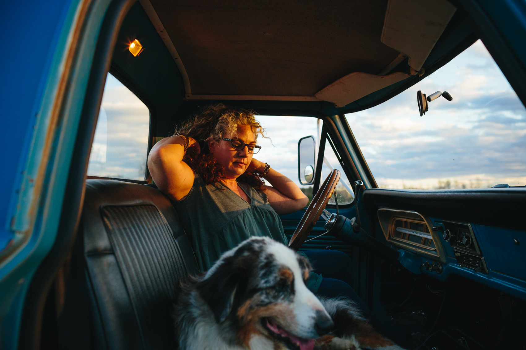 woman with gray streak in truck with dog, washington dc commercial photography