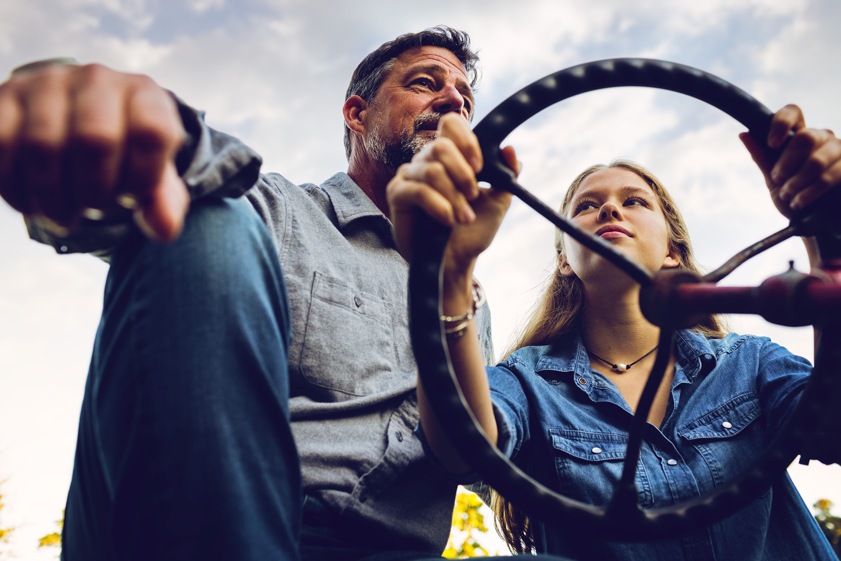 A father teaches his daughter to drive a tractor in near Richmond, Virginia.
