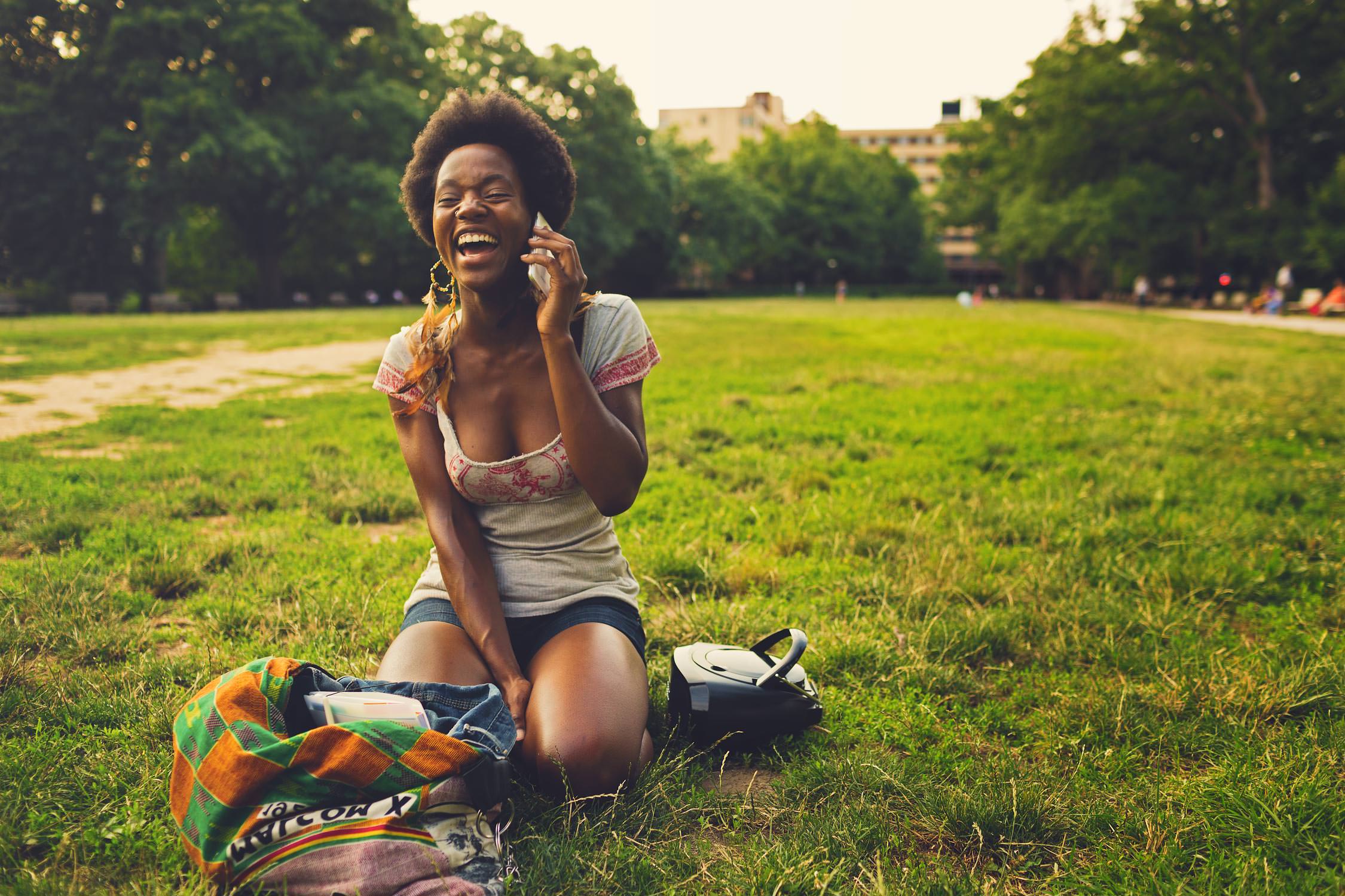 woman on smartphone call in park for washington dc commercial photography
