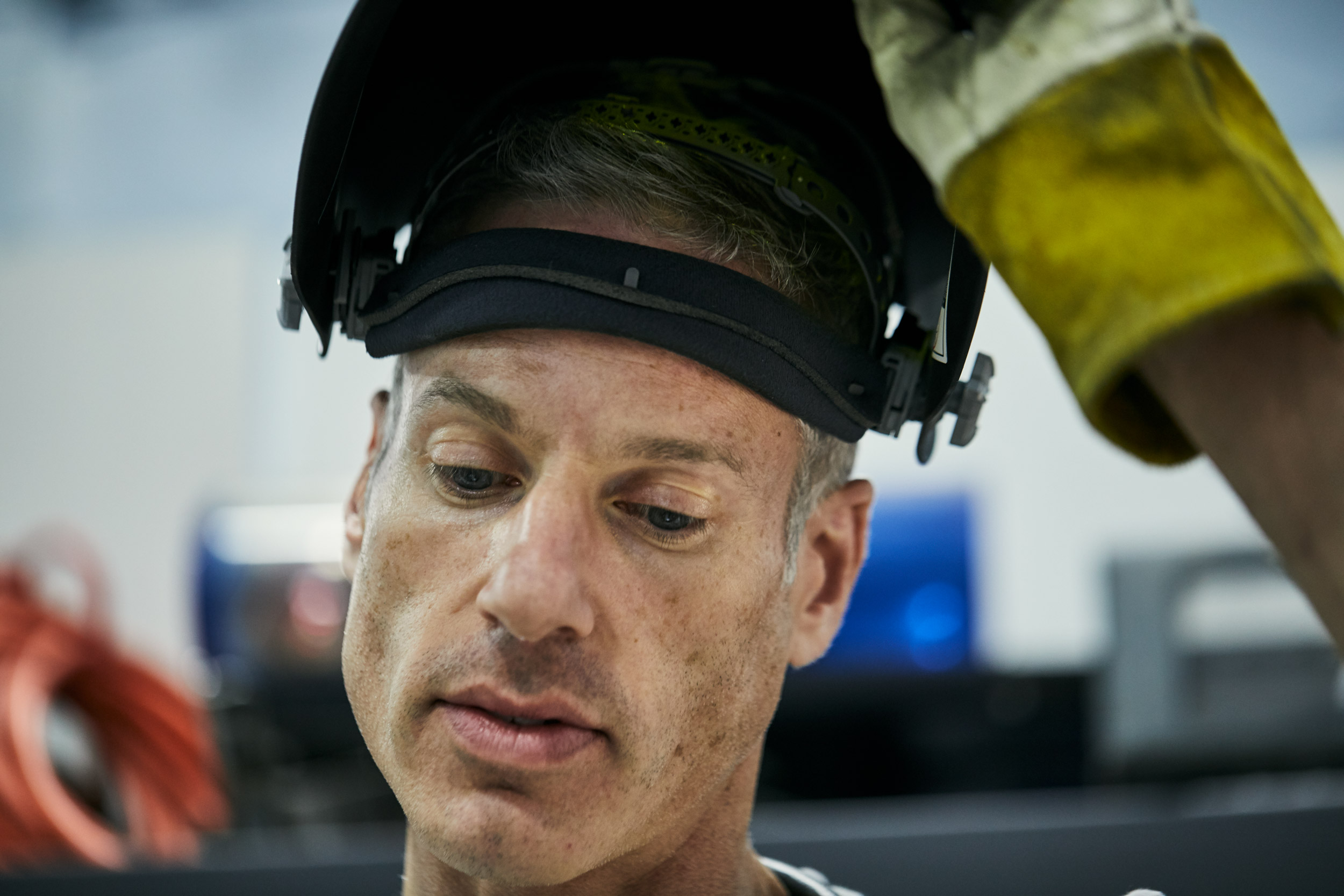 welder lifting helmet, washington dc industrial photographer