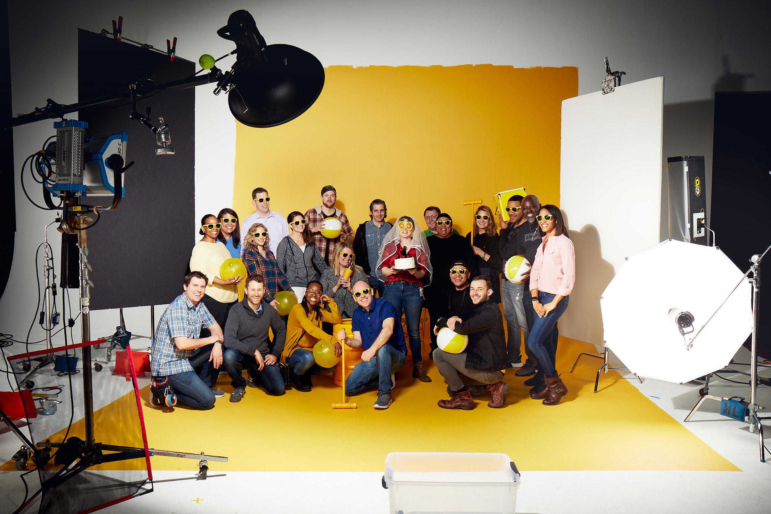 crew standing on yellow cyc, washington dc commercial photography