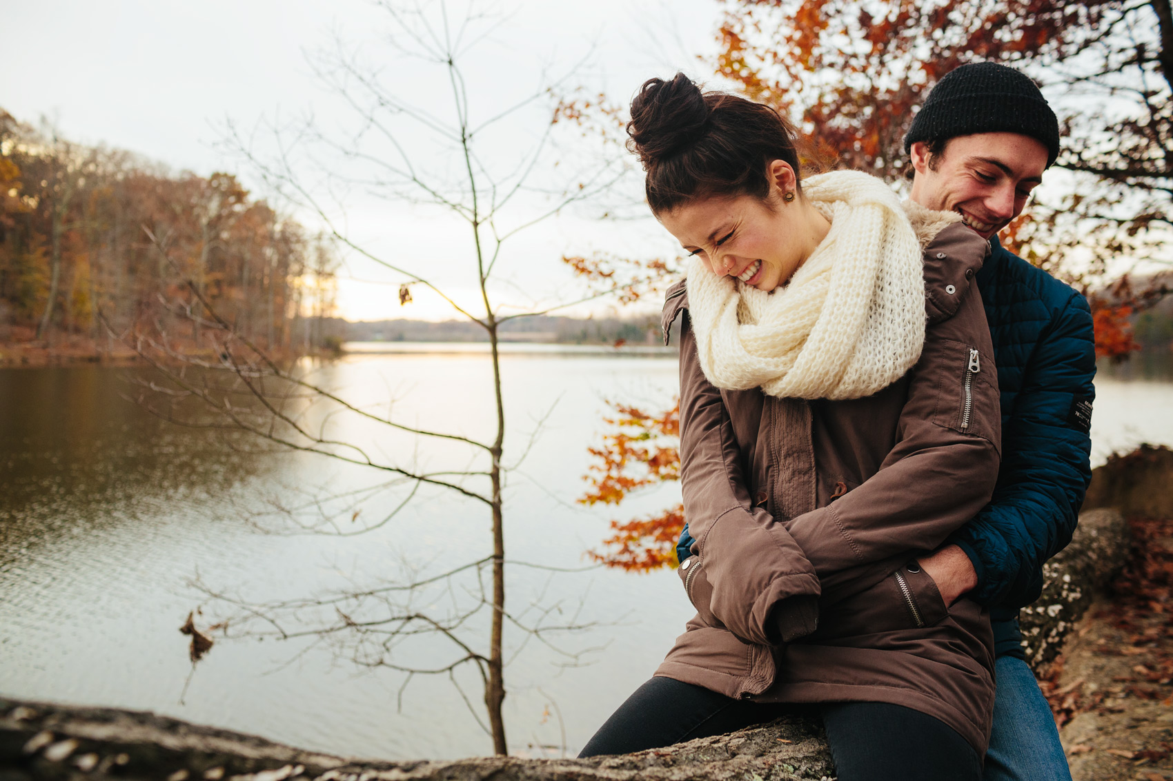 young lovers embracing by a lake for washington dc lifestyle photography